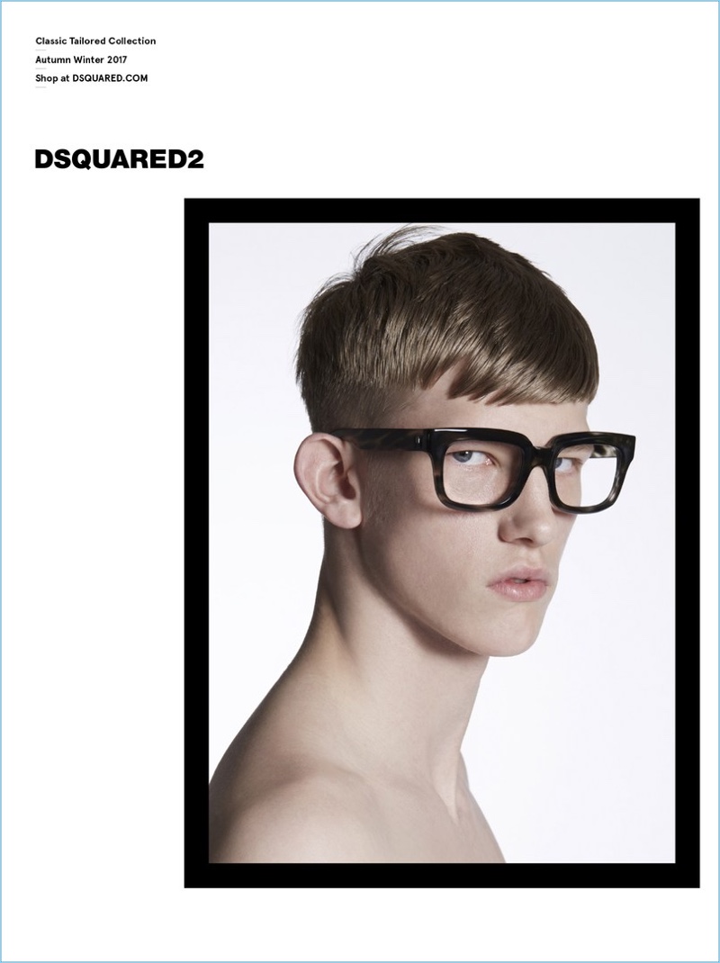 Starring in Dsquared2's Classic Tailored Collection fall-winter 2017 campaign, Connor Newall models thick framed glasses.