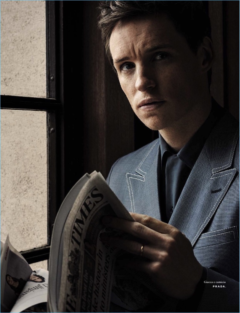 Eddie Redmayne wears a jacket and shirt by Prada.