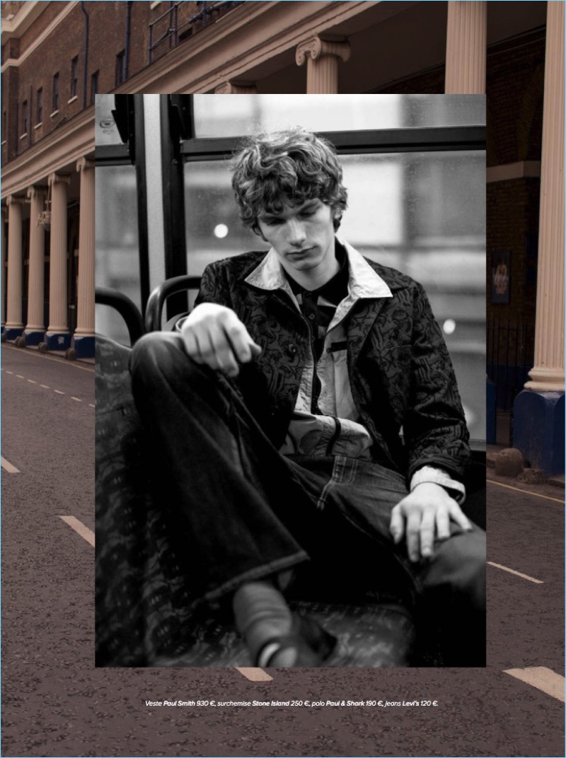 Taking public transportation, Erik van Gils wears a Paul Smith blazer with a Stone Island shirt jacket, Paul & Shark polo, and Levi's jeans.