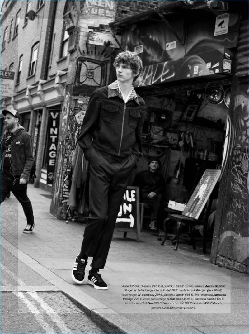 Model Erik van Gils wears a shirt, jacket, and pants by Lanvin with Adidas sneakers.