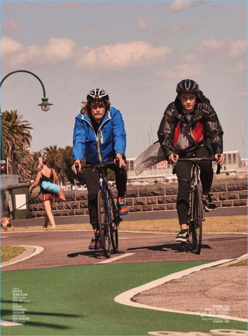 Harry Goodwins and Hao Yun Xiang ride bikes with GQ China. Both models wear Prada fashions with Puma sneakers.