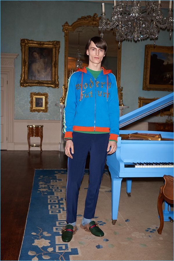 Mix colors with a Gucci hoodie $2,980, jacquard knit wool sweater $1,100, trousers $1,150, and shearling lined backless loafers $995.