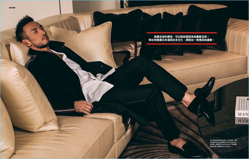 Relaxing in luxury, Hidetoshi Nakata wears brands such as Saint Laurent and Versace.