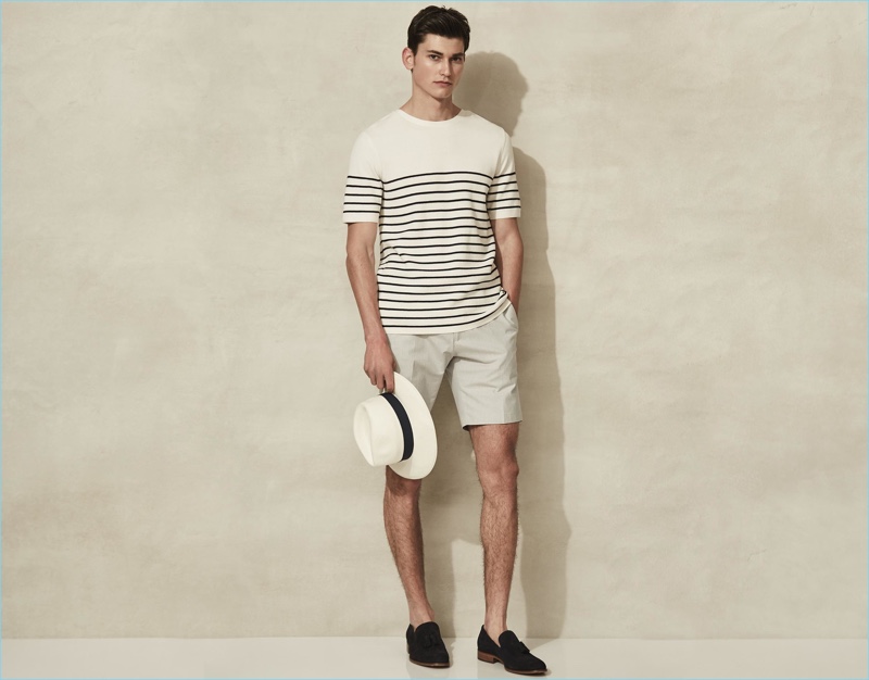 Riviera style is front and center with Reiss' Breton stripe short-sleeve sweater. The casual staple complements a Panama hat, off-white tailored shorts, and suede tasseled loafers.