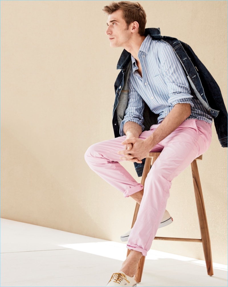 French model Clément Chabernaud dons a J.Crew denim jacket with a slim lightweight oxford shirt. Clément also wears J.Crew lightweight garment-dyed chinos and Vans for J.Crew canvas sneakers.