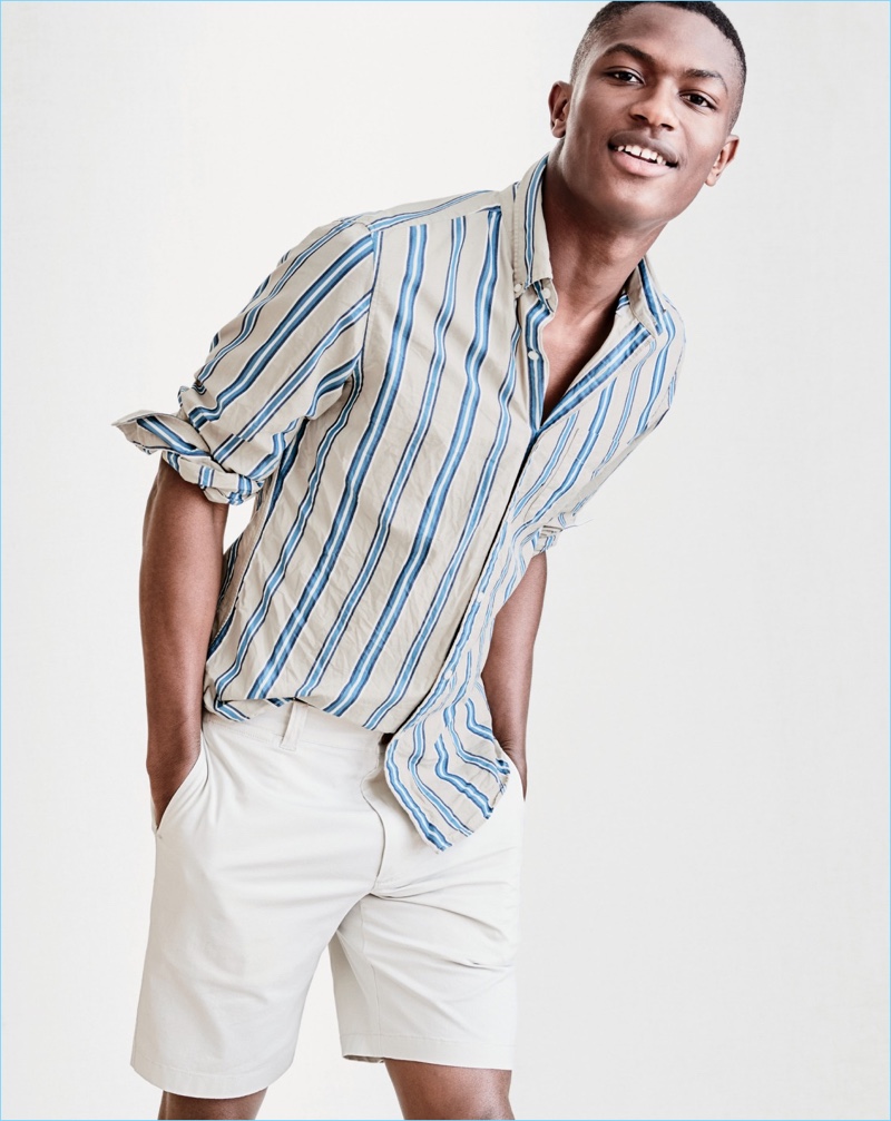 All smiles, Hamid Onifade wears a J.Crew Secret Wash striped shirt with 9" stretch shorts.