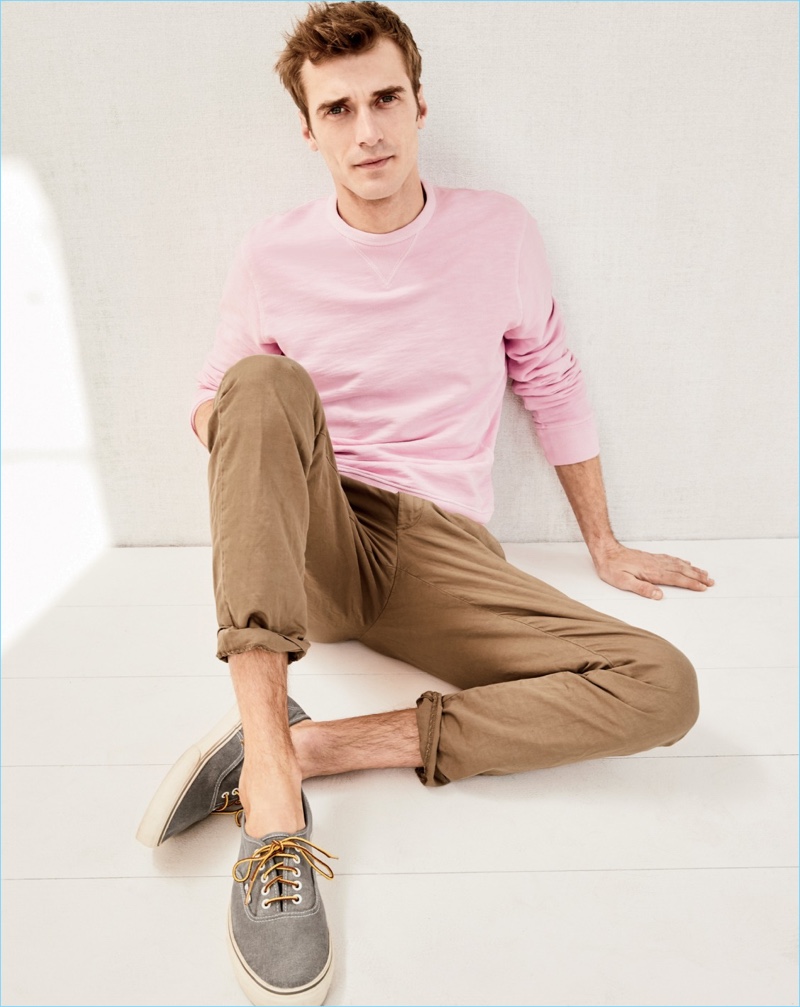 Front and center, Clément Chabernaud sports a J.Crew garment-dyed sweatshirt, stretch chino pants, and Vans for J.Crew washed canvas sneakers.