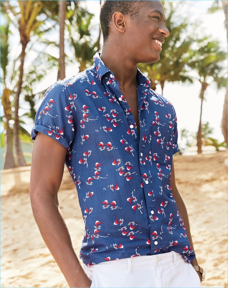 All smiles, Hamid Onifade models a J.Crew short-sleeve seersucker shirt $69.50 and stretch chinos $68.