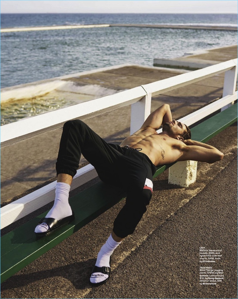 Taking a break, Jack Tyerman wears Dior Homme jogging pants, Hung Apparel socks, and Birkenstock slide sandals.