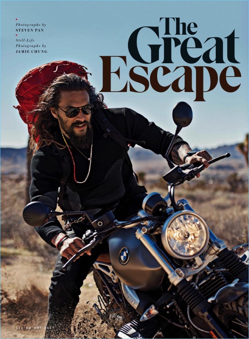 Jason Momoa wears a Nanamica crewneck with AG jeans and John Varvatos sunglasses.