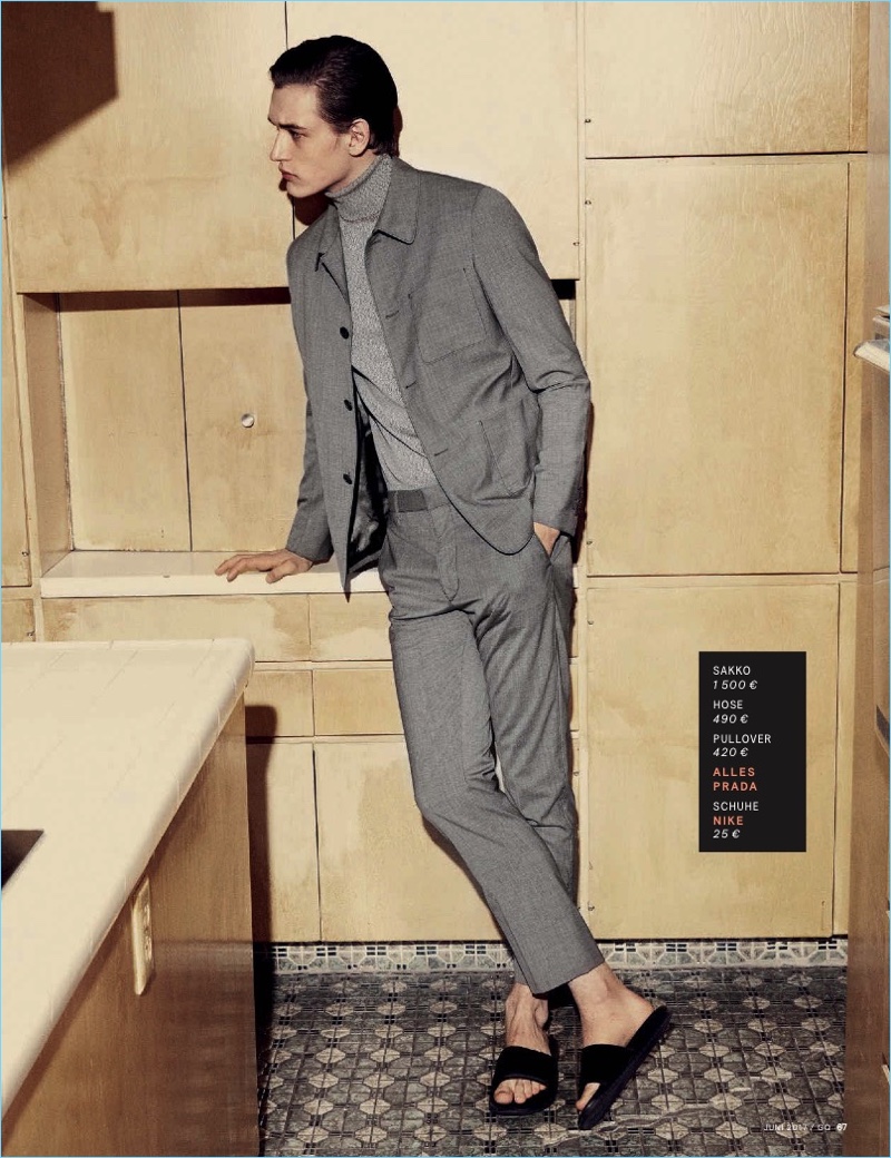 Embracing shades of grey, Jegor Venned wears a turtleneck and suit by Prada with Nike sandals.