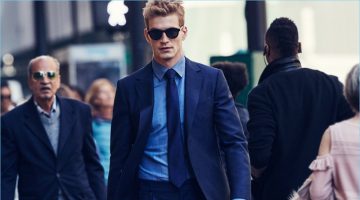 Navigating the streets of New York, Jesse Shannon wears a Salvatore Ferragamo suit with a Canali shirt, Turnbull & Asser tie and sunglasses.