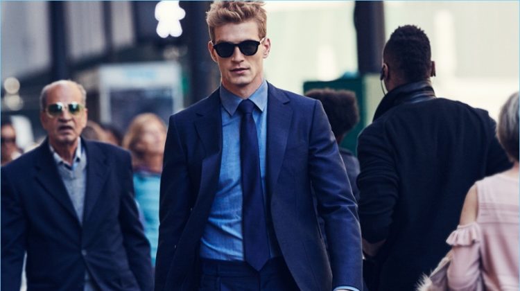 Navigating the streets of New York, Jesse Shannon wears a Salvatore Ferragamo suit with a Canali shirt, Turnbull & Asser tie and sunglasses.