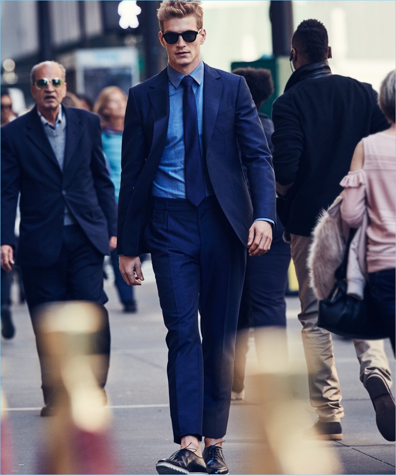 Navigating the streets of New York, Jesse Shannon wears a Salvatore Ferragamo suit with a Canali shirt, Turnbull & Asser tie and sunglasses.