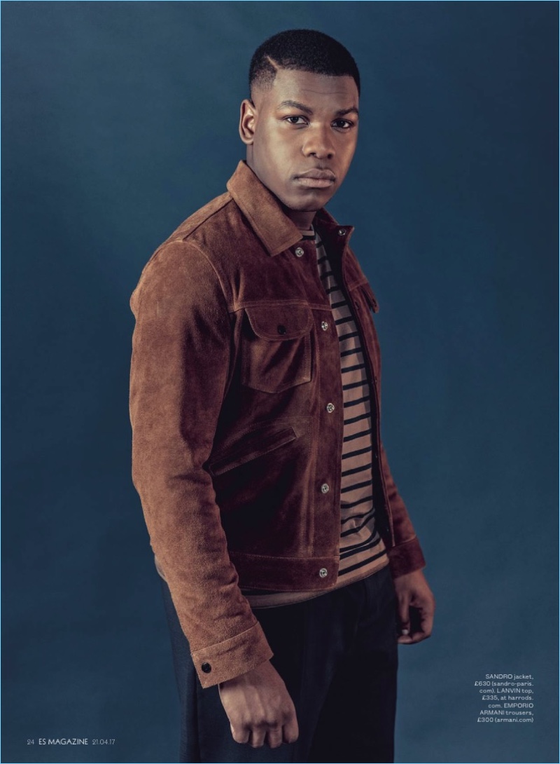 Front and center, John Boyega sports a Sandro jacket with a striped Lanvin tee and Emporio Armani trousers. » John Boyega Covers ES Magazine, Addresses Samuel L. Jackson Comments Front and center, John Boyega sports a Sandro jacket with a striped Lanvin tee and Emporio Armani trousers.