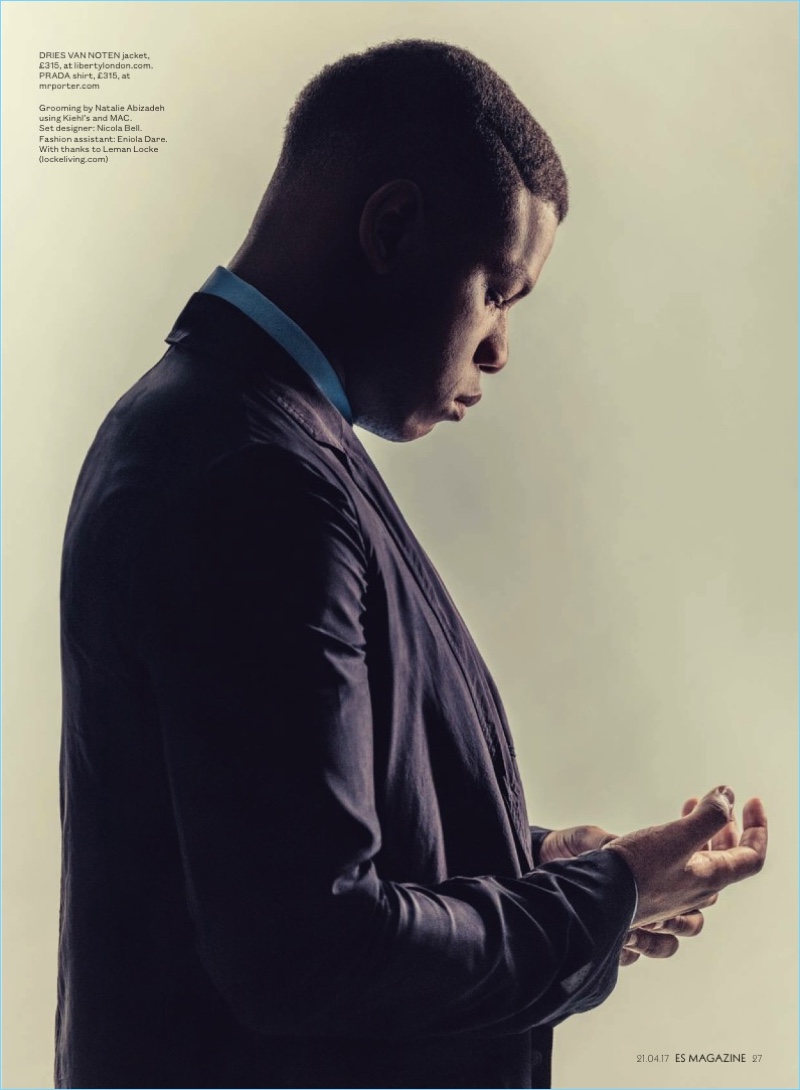Delivering a side profile, John Boyega wears a Dries Van Noten blazer with a Prada shirt.