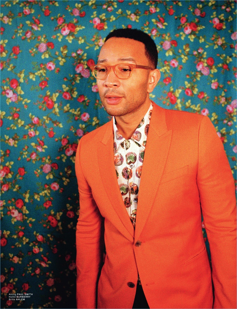 Embracing a pop of color, John Legend dons a Paul Smith blazer with a Burberry shirt and Aklem glasses.