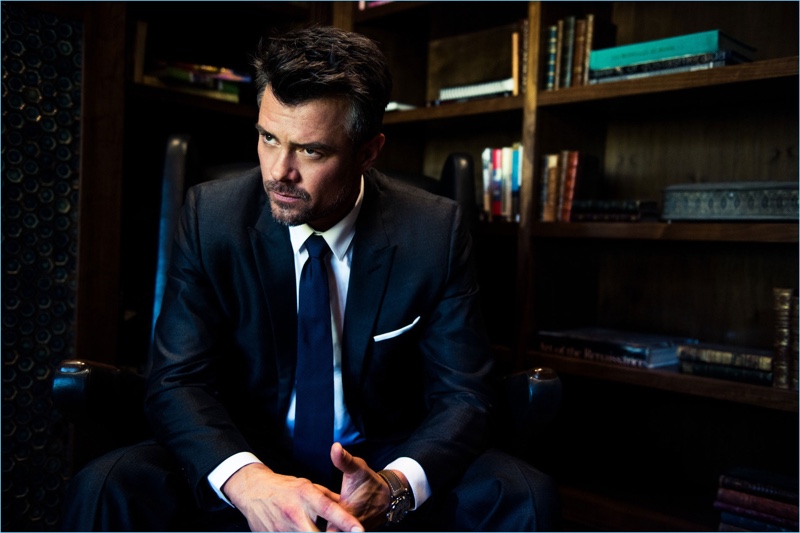 Actor Josh Duhamel wears a Dior Homme suit with a Dolce & Gabbana shirt, Ermenegildo Zegna tie, and a Panerai watch.