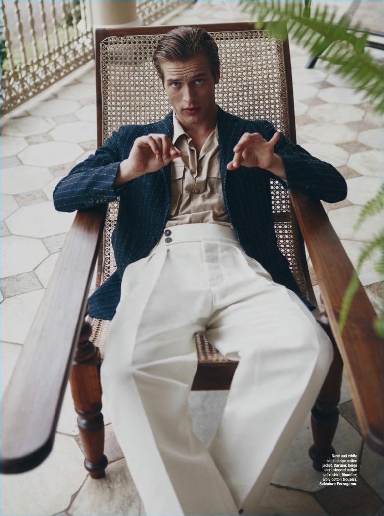 Model Jules Raynal sports a Caruso jacket with a Moncler shirt and Salvatore Ferragamo trousers.