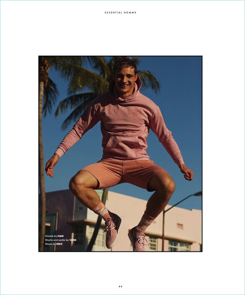 Jumping for joy, Julian Schneyder wears a hoodie by H&M with shorts and socks by Vans. Julian also sports Nike shoes.