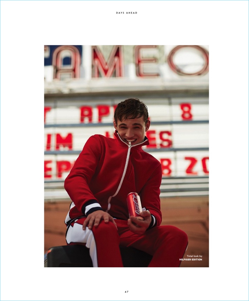 All smiles, Julian Schneyder rocks a red tracksuit by Hilfiger Edition.