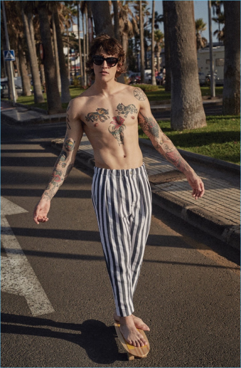 A shirtless Leebo Freeman goes skateboarding in striped pants for Fox Haus' summer 2017 campaign.