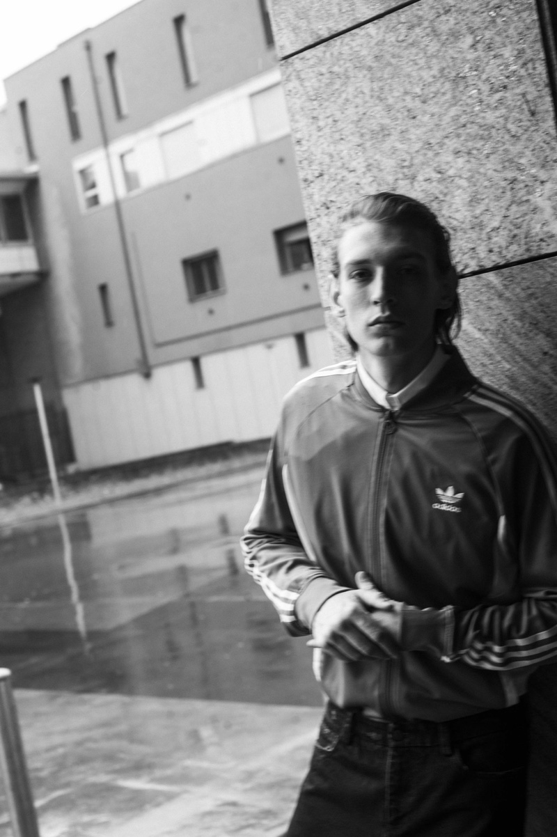 Lucas wears track jacket Adidas, shirt Ralph Lauren, and jeans Antonio Marras.