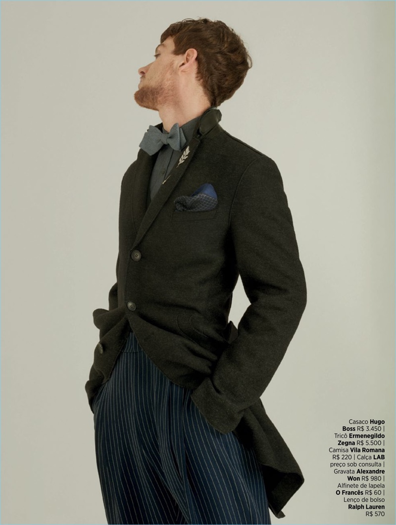 A dandy image, Lucas Mascarini dons a Hugo Boss coat, Vila Romana shirt, and striped LAB trousers.