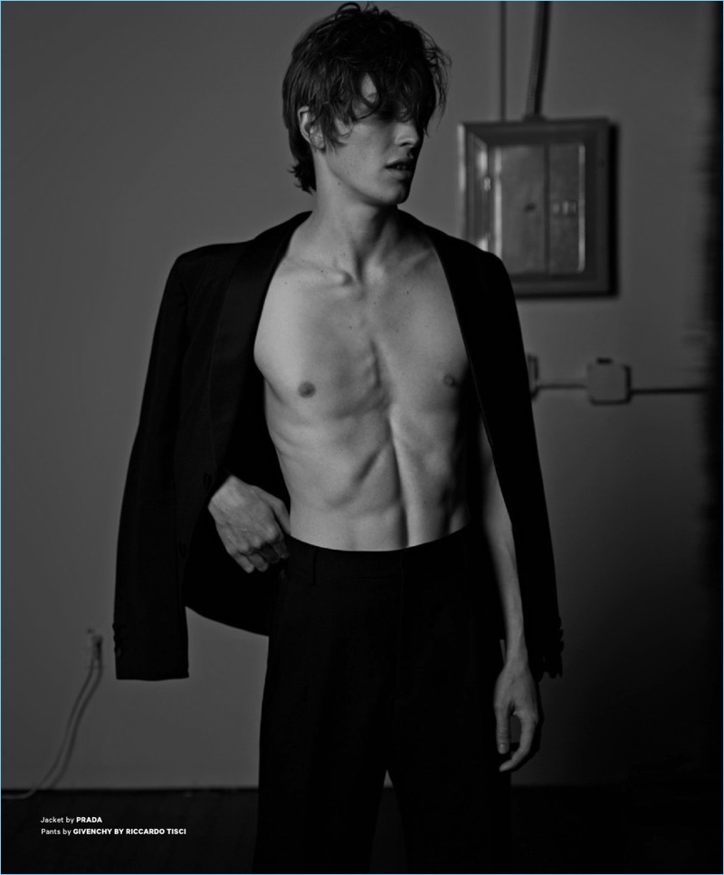 Model Lucas Satherley dons a Prada jacket with Givenchy trousers.