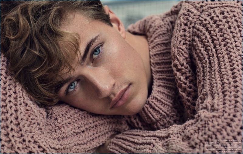 Delivering a beauty close-up, Lucky Blue Smith wears a Maison Margiela sweater.