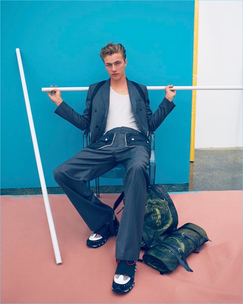 Embracing a pinstripe motif, Lucky Blue Smith dons a designer look from Givenchy.