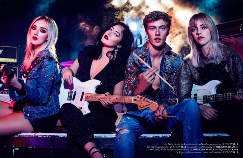 Model Lucky Blue Smith joins his sisters for a feature on their band, The Atomics. Lucky wears a Roberto Cavalli denim jacket with GUESS jeans.