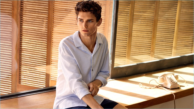 A summer vision, Arthur Gosse sports a Mango Man linen-blend shirt $69.99 and contrast trim swim shorts $49.99.