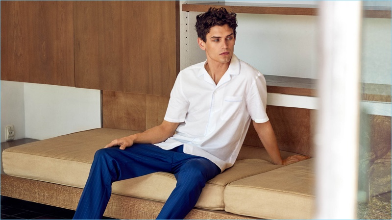 Relaxing, Arthur Gosse wears a Mango Man regular fit cotton linen-blend shirt $69.99 and wool-blend cropped trousers $89.99.