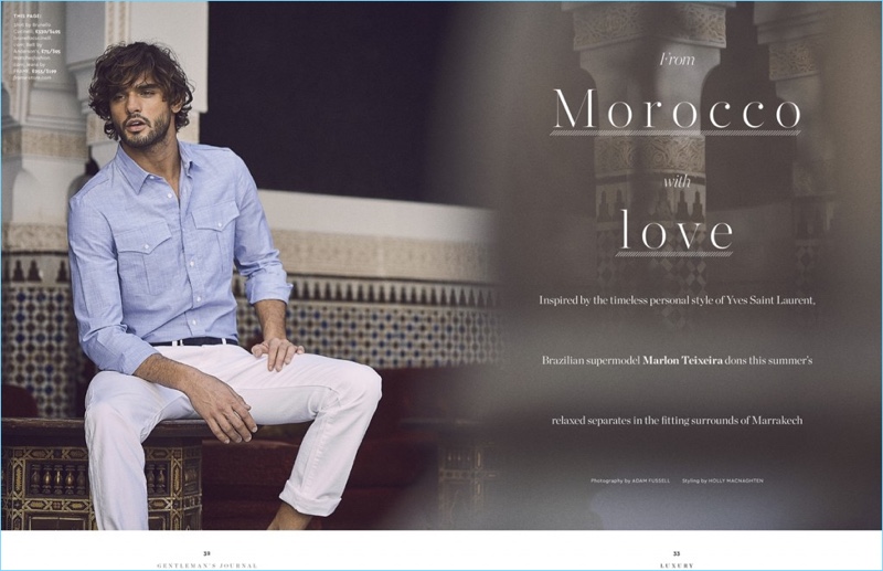 Model Marlon Teixeira dons a Brunello Cucinelli shirt with an Anderson's belt, and Frame Denim jeans.