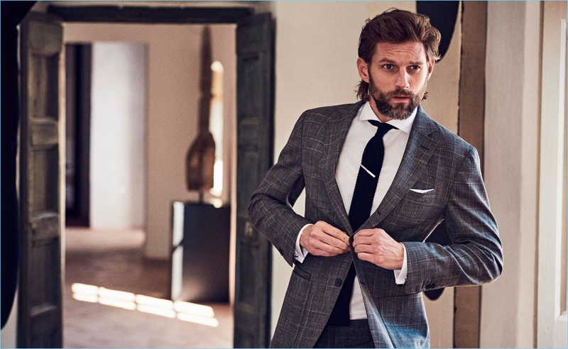 RJ Rogenski connects with Massimo Dutti, sporting a dashing single-breasted suit.