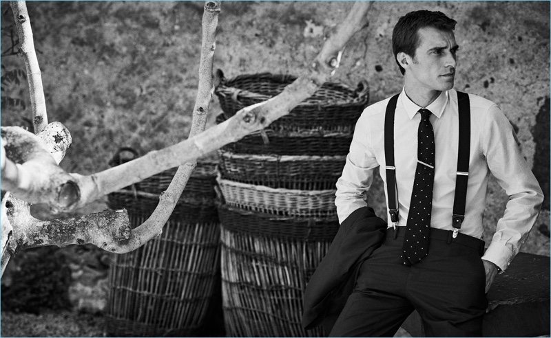 French model Clément Chabernaud wears a smart shirt and trousers with suspenders from Massimo Dutti.