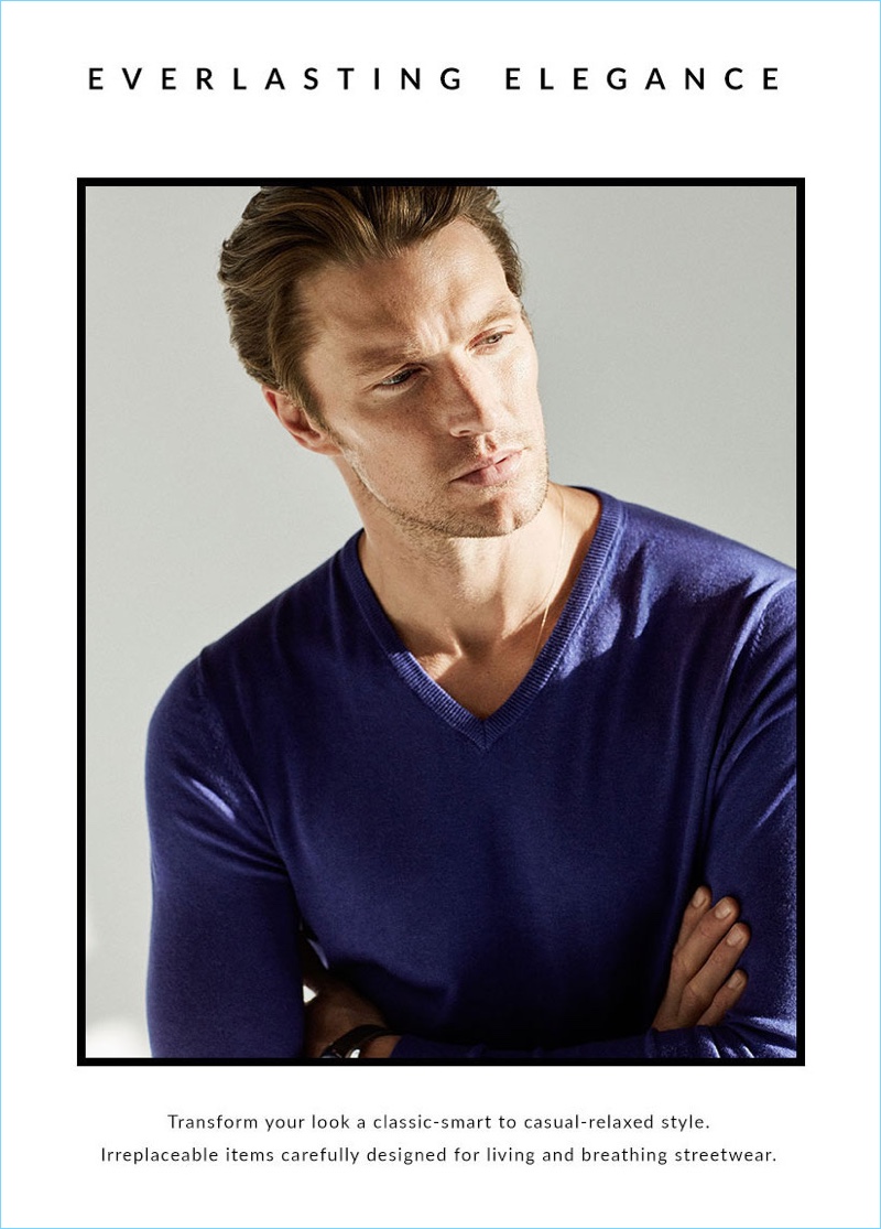 Model Shaun DeWet sports a v-neck sweater from Massimo Dutti.