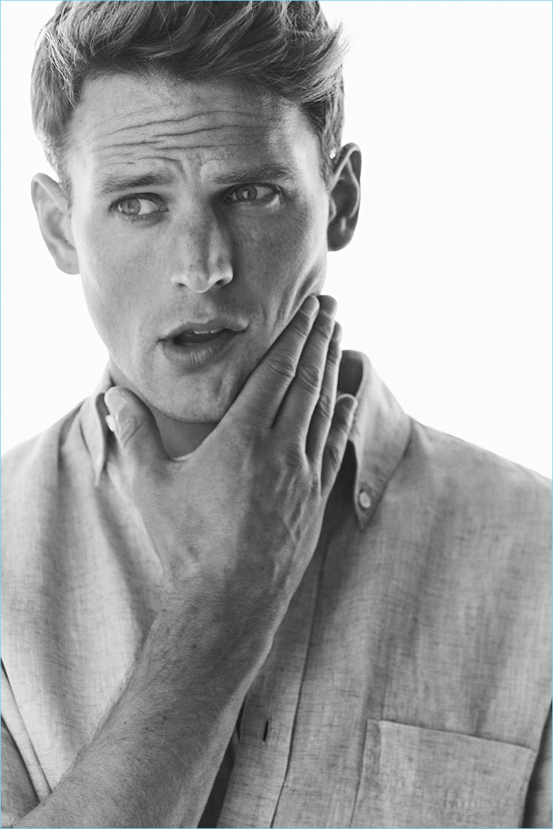 Appearing in a black and white photo, Guy Robinson wears a linen shirt by Massimo Dutti.