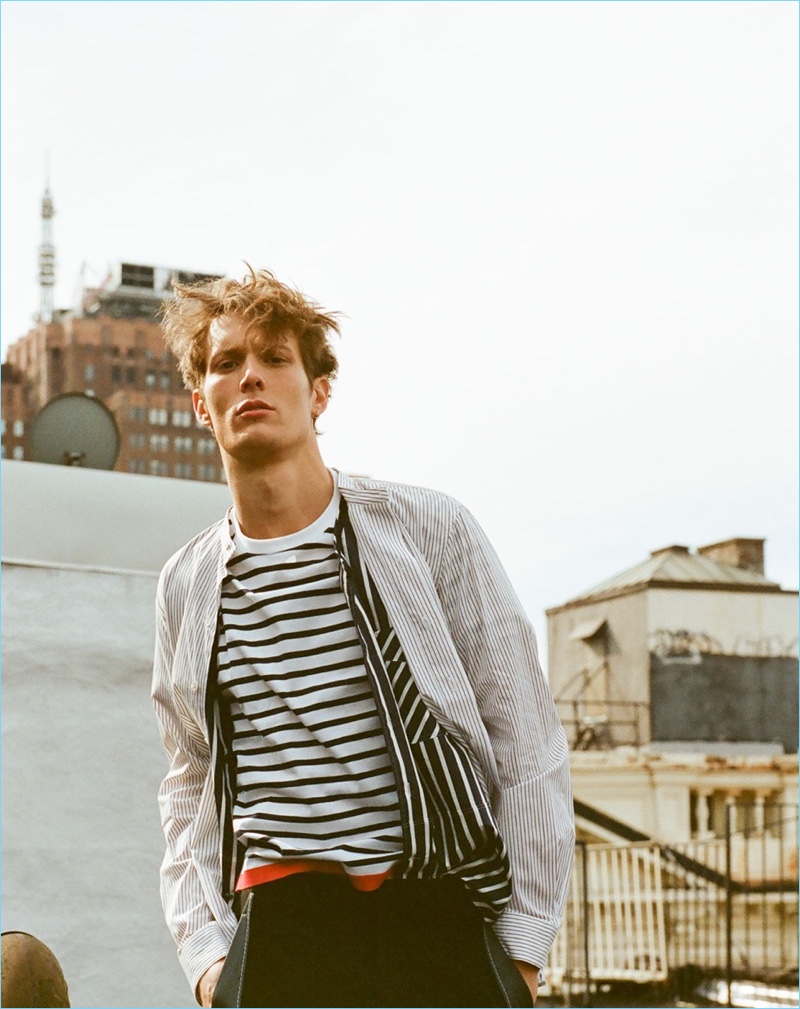 Mixing stripes, Felix Gesnouin wears a Tomorrowland striped t-shirt $187, sleeveless Lanvin shirt $587, Lemaire mandarin collar shirt $275, and Lanvin contrast-panel wool trousers $668.