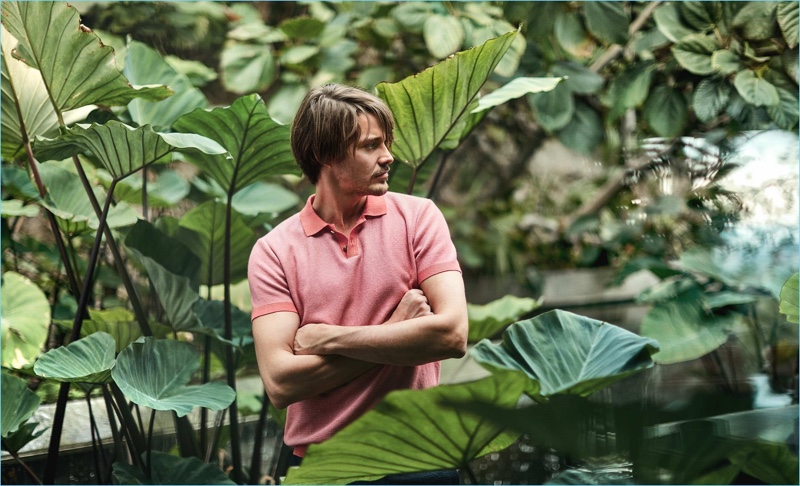 Front and center, Rob Moore wears an Orley polo $372 with Orlebar Brown shorts $181.