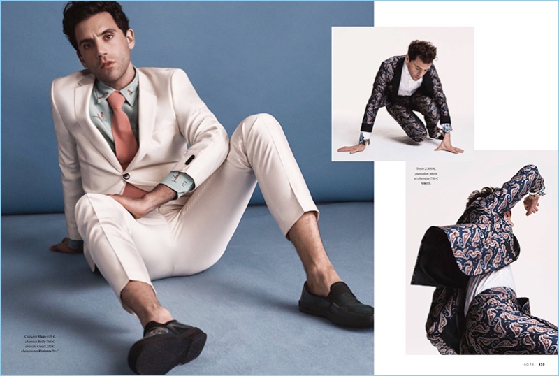 Left: Taking to the studio, Mika sports a HUGO Hugo Boss suit with a Bally shirt, Gucci tie, and Rivieras shoes. Right: Mika rocks a dandy Gucci look.