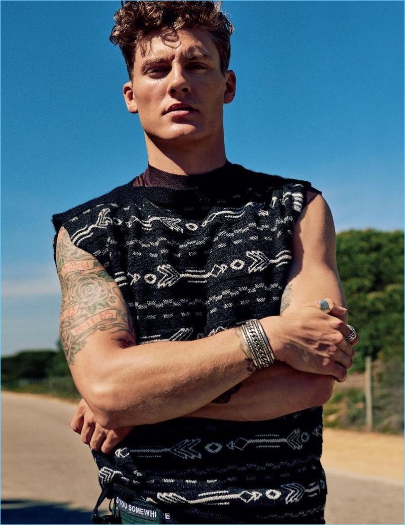 Model Mikkel Jensen wears a sleeveless top from Kenzo.