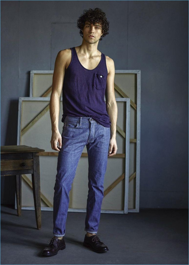 Front and center, Miles McMillan models a Todd Snyder linen jersey button tank $88 and selvedge denim jeans $198.