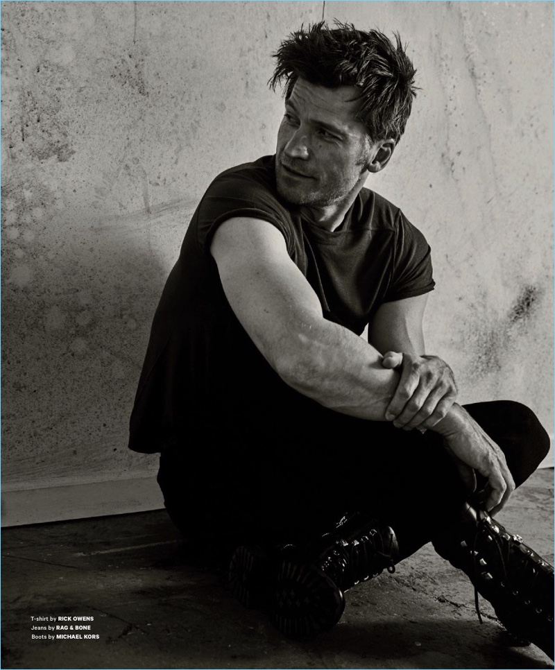 Relaxing, Nikolaj Coster-Waldau sports a Rick Owens t-shirt with Rag & Bone jeans, and Michael Kors boots.