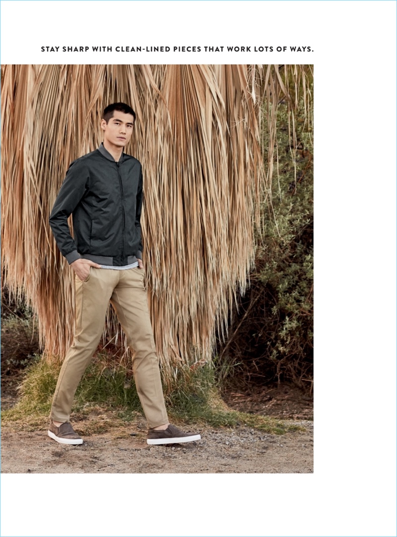 Going casual, Hao Yun Xiang models a Calibrate lightweight bomber jacket $99 and chinos $79.50. Hao also wears To Boot New York slip-on sneakers.