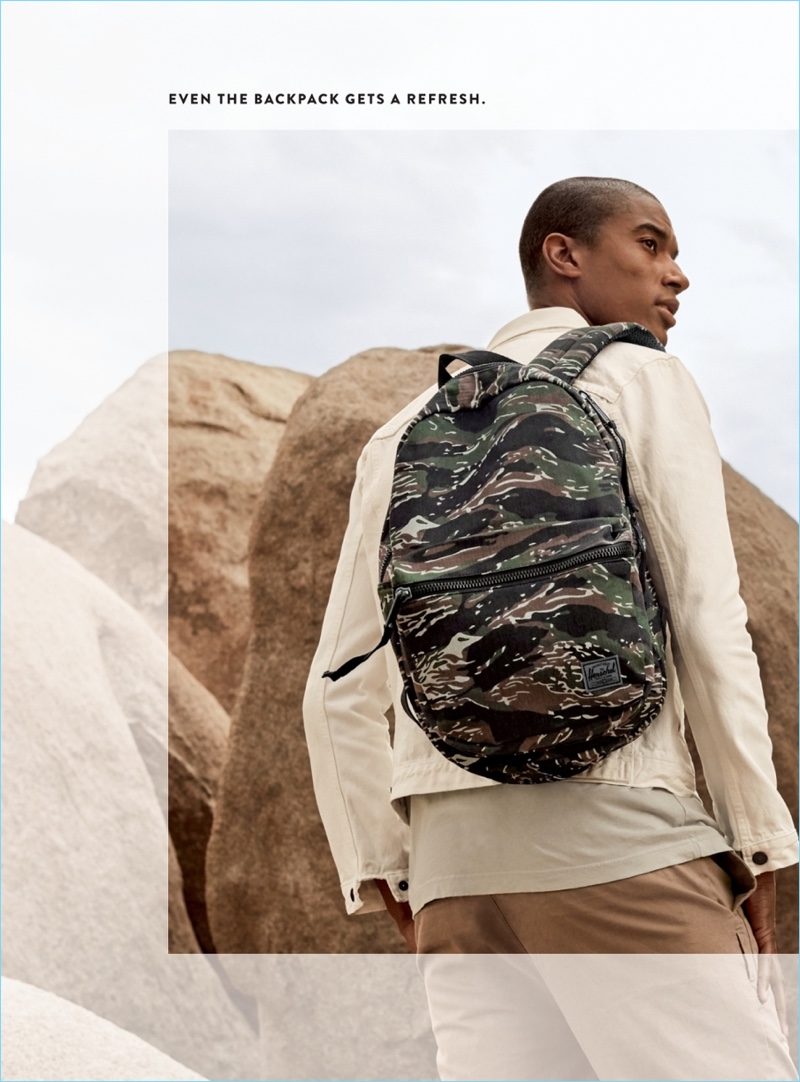 Heading outdoors, Claudio Monteiro sports a Herschel Supply Co. Lawson Surplus backpack $67.49. Claudio also wears a Levi’s Orange Tab denim jacket $98, James Perse jersey t-shirt $60, and Zanerobe cropshot crop chinos $99.