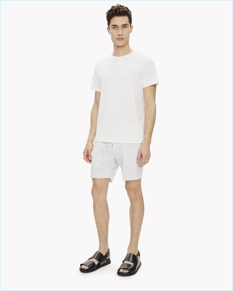 Making a minimal statement Lucas Goossens wears Onia x Theory Alek board shorts 5" $145.