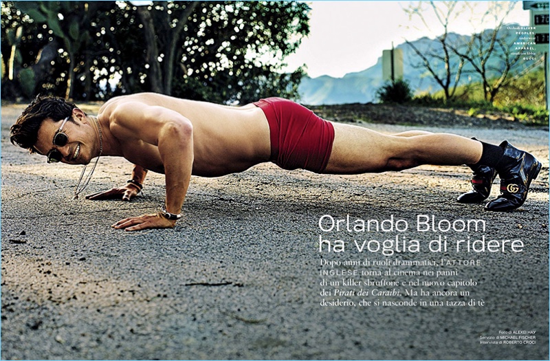 Actor Orlando Bloom wears Oliver Peoples sunglasses with American Apparel underwear and Gucci boots.