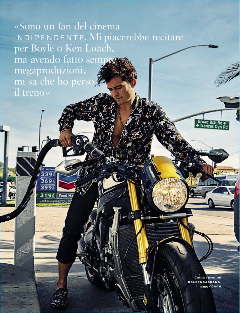 Alexei Hay photographs Orlando Bloom in Coach shoes with a printed shirt and trousers by Dolce & Gabbana.